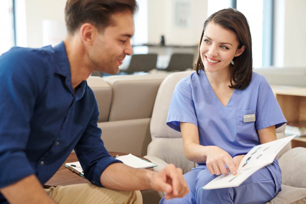 Nurse talking to patient