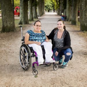 Woman in wheelchair with carer