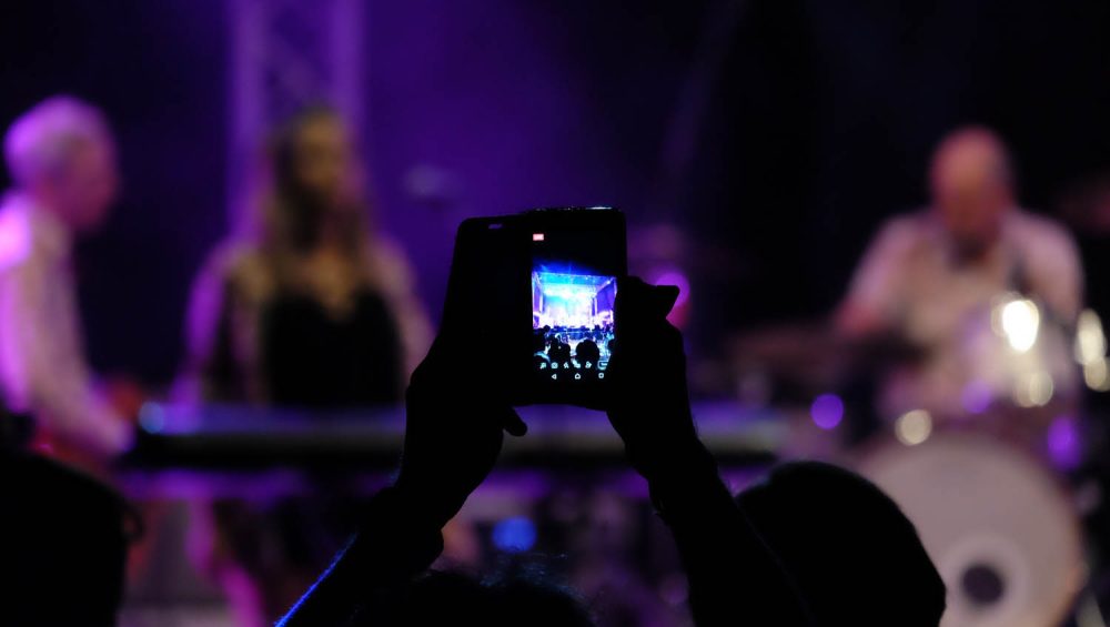 Screen on camera filming people in background