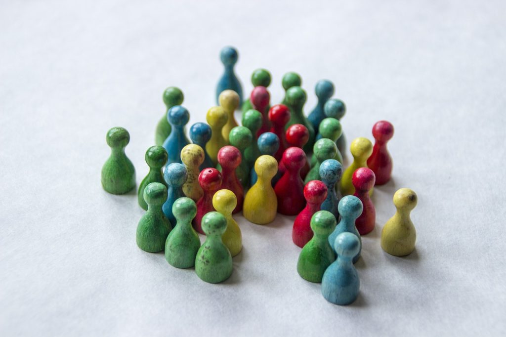 Boardgame pieces in multicolours as a collective.