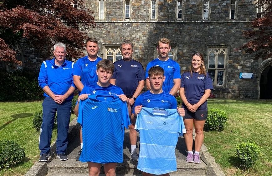 Staff and students outside UWTSD Academy of Sport.