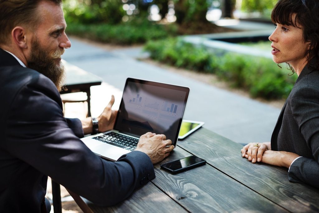 Two people meeting over a laptop