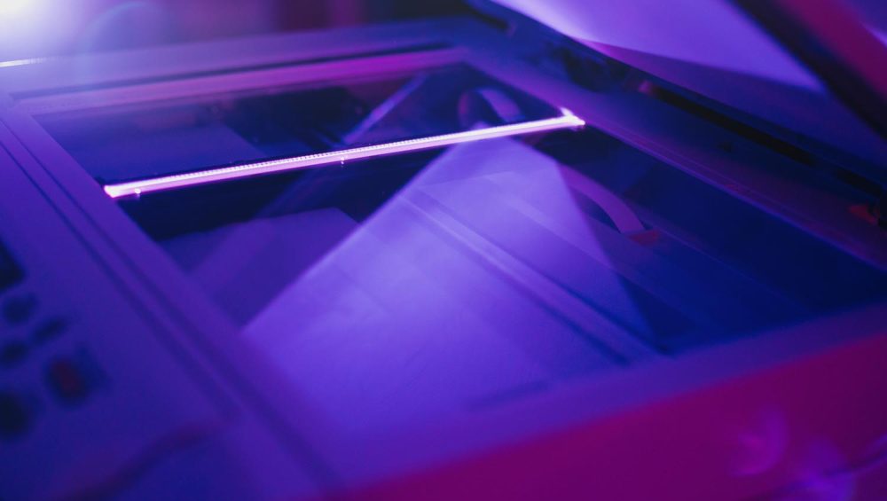 Copier scanner with a bright light inside.