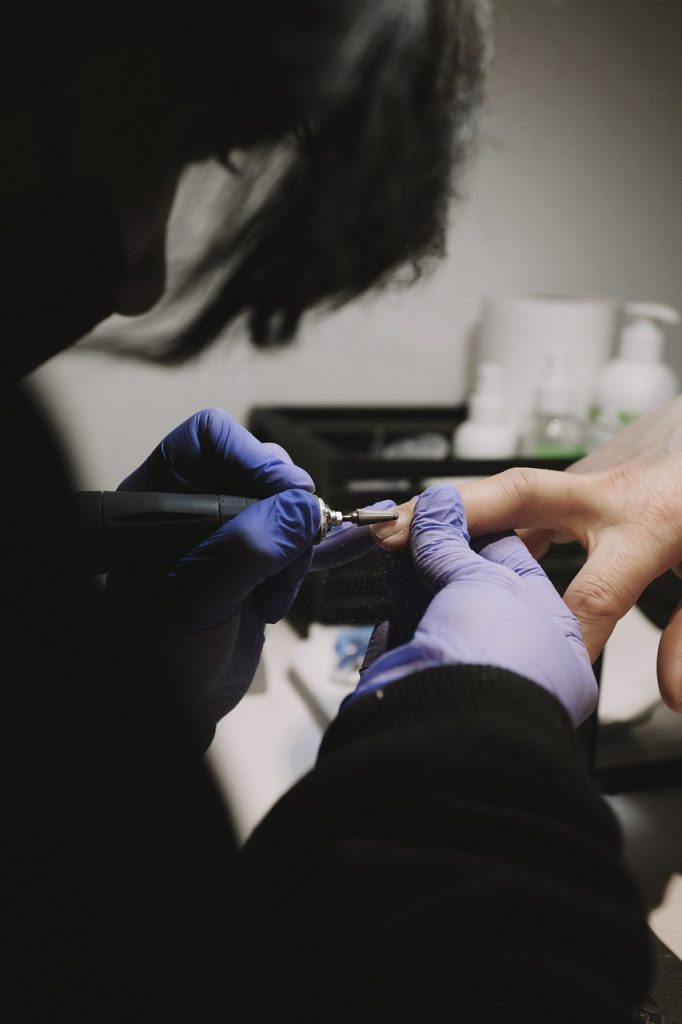 Therapist Filing Nails