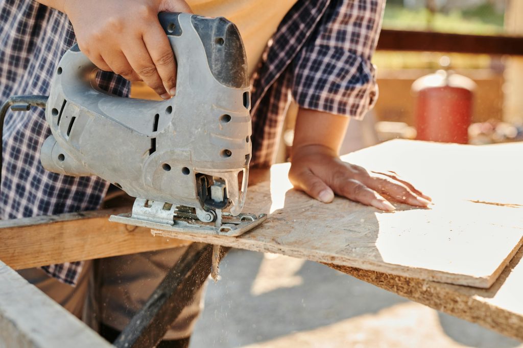 man on site using a saw