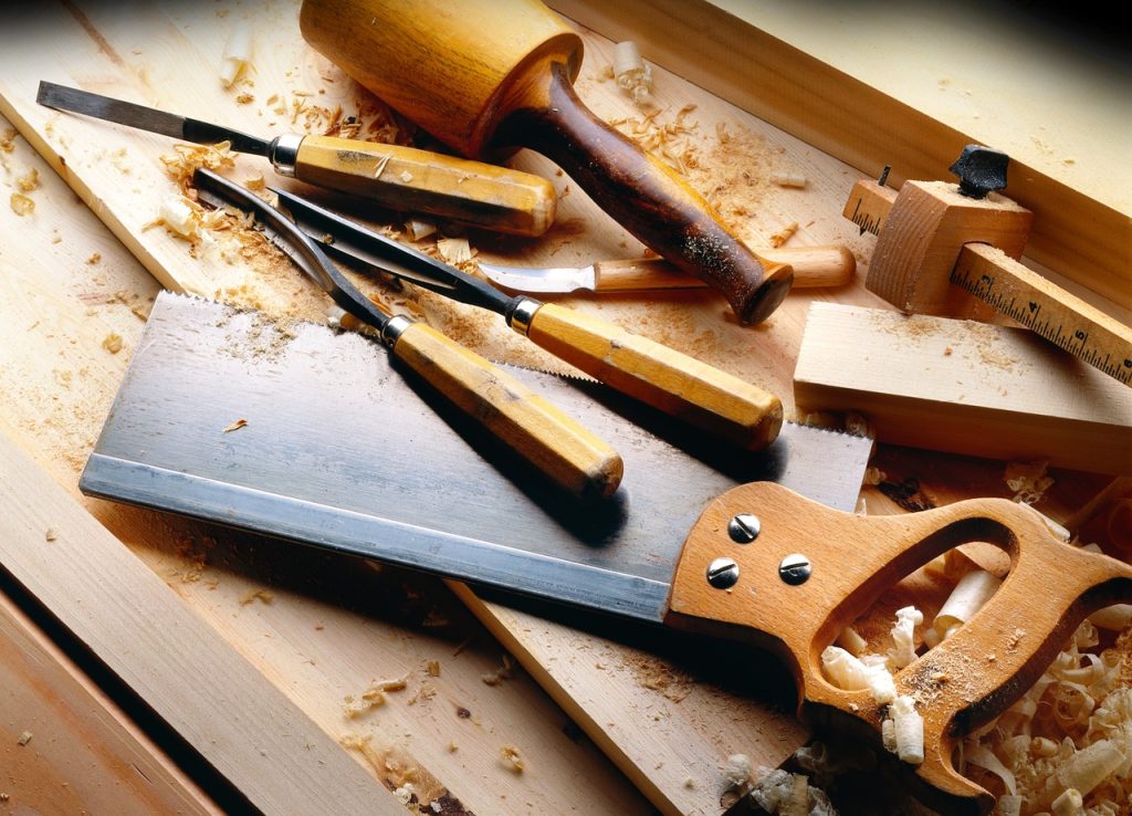 A saw, chisels and various carpentry tools